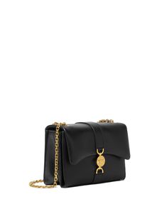 Versace Kelio Crossbody Bag in Black and Gold Fold over flap Magnetic interlocking closure Adjustable chain shoulder straps Interior slip compartments Medusa ’95 hardware Lambskin outer and lining 3.5” W x 6.5” H x 8.7” L 10.8” – 20.1” strap drop Made in Italy Versace Crossbody Bags, Luxe Black Bags With Gold-tone Hardware, Black Luxury Flap Bag With Gold-tone Hardware, Luxury Black Bags With Gold-tone Hardware, Luxury Black Shoulder Bag With Gold Chain, Versace Bags, Black Purses, Leather Crossbody, Versace