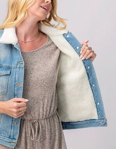 "Stay warm in style this spring with this Vintage Denim Sherpa Lined Collar Jean Jacket! This premium quality denim jacket features a cozy Sherpa lining in the collar, making it perfect for those chilly spring days. Available in sizes S, M, L, XL, this jacket is the perfect addition to your wardrobe for a timeless and versatile look. Whether you wear it on its own or layer it over your favorite outfits, this jacket will keep you warm and comfortable all season long. Don't miss out on this must-h Winter Light Wash Denim Jacket, Cozy Cotton Outerwear For Spring, Light Wash Denim Jacket For Winter, Winter Relaxed Fit Denim Jacket With Button Closure, Trendy Light Wash Denim Jacket For Winter, Trendy Light Wash Winter Outerwear, Cold Weather Cotton Denim Jacket, Spring Denim Jacket With Pockets For Cold Weather, Winter Light Wash Outerwear For Everyday