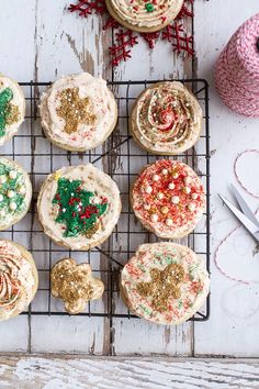 several decorated cookies on a cooling rack