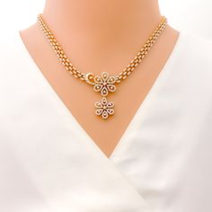 This exquisite 18k gold set, weighing 37.6 grams, features a stunning royal flower drop design adorned with dazzling diamonds. The yellow gold finish enhances its luxurious appeal, making it perfect for any special occasion. The set includes a necklace with a total diamond weight of 4.97 carats, featuring F-G color and VS quality diamonds in round and baguette shapes. The necklace has a length of 16.5 inches with a 1.4-inch drop length, adjustable 0.7-inch links, and a secure hook lock. The matc Formal Diamond Flower Shaped Jewelry, Flower-shaped Diamond Necklace With Single Cut Diamonds, Flower Shaped Diamond Necklace With Single Cut Diamonds, Elegant Flower Shaped Jewelry With Single Cut Diamonds, Exquisite Diamond Flower-shaped Jewelry, Elegant Flower-shaped Jewelry With Single Cut Diamonds, Elegant Gold Jewelry Sets With American Diamond, Luxury Diamond Necklace With Flower Shape For Anniversary, Elegant Gold American Diamond Jewelry Sets