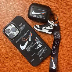 an iphone case with a lanyard attached to it next to a pair of sneakers