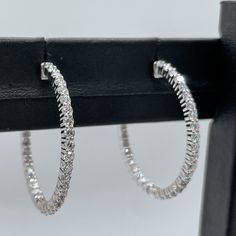 Pictured: Left to right on first image- 1 Inch Inside Out Lab Grown Diamond Hoop Earrings Set In 14KT White Gold 1.65CTS - 1.3 Inch Inside Out Lab Grown Diamond Hoop Earrings Set In 14KT White Gold 2.3CTS - 1.5 Inch Inside Out Lab Grown Diamond Hoop Earrings Set In 14KT White Gold 2.9CTS Hoop Earrings With Halo Design, Classic Small Hoop Earrings Aaa Quality, Aaa Quality Small Hoop Classic Earrings, Formal Aaa Quality Small Hoop Earrings, Aaa Quality Diamond Hoop Jewelry, Aaa Quality Hoop Diamond Earrings In White Gold, Fine Jewelry Round Hoop Earrings With Halo Design, Aaa Quality Diamond Hoop Earrings, Aaa Quality White Gold Hoop Diamond Earrings