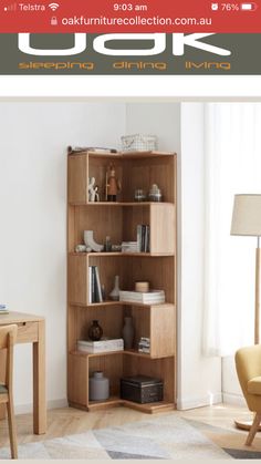 a wooden book shelf sitting on top of a hard wood floor