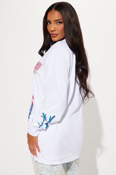 Available In White. Crew Neck Long Sleeve Front Screen Stretch Disclaimer: Due To The Printing Process A Difference In Saturation May Occur. Each Garment Is Unique 100% Cotton Imported | Bugs Bunny USA Dream Team Tee Shirt in White size Small by Fashion Nova White Long Sleeve Tops With Graphic Print, White Long Sleeve Top With Graphic Print, Summer Graphic Tee With Long Sleeves, Sporty Long Sleeve Shirt For Spring, White Long Sleeve Cotton Tops, White Cotton Long Sleeve Tops, White Long Sleeve Shirt With Letter Print, White Long Sleeve Tops For Streetwear, Trendy White Long Sleeve T-shirt