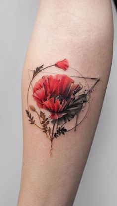 a woman's arm with a red flower and geometric tattoo on the left forearm