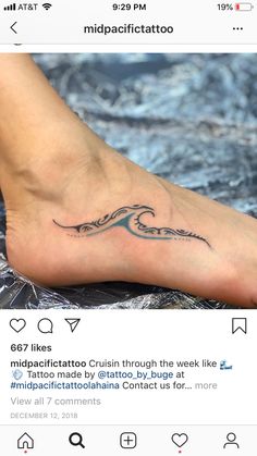 a person's foot with a tattoo on the top and bottom of their feet