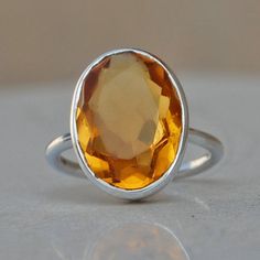 Mandarin Citrine 925 Sterling Silver Ring, 18K Rose Gold, 18K Yellow Gold Oval Cut Yellow Citrine Ring, Statement Ring , Zodiac Jewelry Gemstone : Citrine Quartz Stone Size : 12 x 16 mm Ring Size : Please Choose Your Size stone Color : Yellow Color Material : Please choose your metal It's a unique gift for anyone zodiac style ring . Please Notice before checkout :- Due to we use natural stones, the stones may vary slightly in shape, size and color. Contact us for any other gemstone customization Orange Oval Topaz Ring Gift, Orange Oval Topaz Ring For Gift, Oval Orange Topaz Ring Gift, Oval Orange Topaz Ring For Gift, Orange Oval Sterling Silver Ring, Prasiolite Ring, Green Agate Ring, Yellow Citrine Ring, Cushion Cut Ring