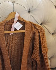 We love this cozy sweater. The absolute softest nubby knit pairs with an open front, slouchy sleeves & cozy front pockets. Slouchy fit & cute nubby seams. Perfect layered with a tee & denim. Color: Timber Poly Hand wash cold Small Medium Large Bust 42 44 46 Waist 42 45 46 Hips 43 46 47 Length 30 30 30 Bust, waist, and hip measurements are a total circumference. Length is measured from the top of the sweater to the hem. Measurements are an estimate. Comfy Fall Cardigan For Everyday, Comfy Everyday Fall Cardigan, Comfortable Soft Knit Cozy Fit Cardigan, Cozy Fit Soft Knit Cardigan, Cozy Open Knit Sweater For Loungewear, Comfortable Cozy Fit Soft Knit Cardigan, Open Knit Cardigan For Fall Loungewear, Soft Knit Cozy Cardigan, Fall Open Knit Sweater For Loungewear