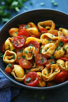 Tortellini pasta with cherry tomatoes and fresh parsley in a black bowl. Tortellini Pasta Recipes, Tortellini Dishes, New Meal Ideas