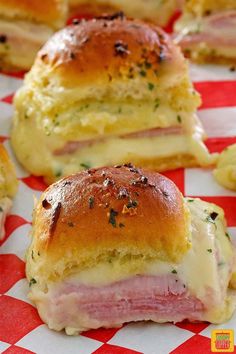 ham and cheese sliders on a red and white checkered paper