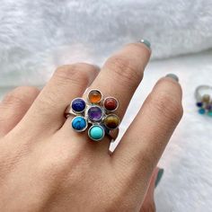 Chakra ring,Rainbow ring,Adjustable ring,Silver plated ring, Gemstones: Amethyst,tigers eye,lapis lazuli,green turquoise,natural turquoise,orange aventurine,red agate.Size: Adjustable.Material: Silver plated, Natural gemstones. You receive an exact ring like the ones shown in the pictures.Amethyst has healing powers to help with physical ailments, emotional issues, and in Energy Healing and Chakra balancing. Amethyst crystal therapies are primarily associated with physical ailments of the nervou Adjustable Rainbow Gemstone Ring, Adjustable Multi-stone Crystal Ring Gift, Healing Natural Stones Open Crystal Ring, Adjustable Multicolor Crystal Ring, Adjustable Spiritual Amethyst Ring With Natural Stones, Stone Ring For Men, Chakra Ring, Stone Rings For Men, Orange Aventurine