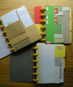 several notebooks are stacked on top of each other