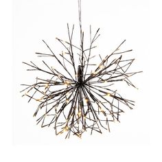 a chandelier made out of branches with lights