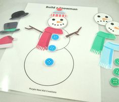 a snowman cut out on top of a sheet of paper next to some buttons