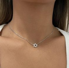 The Star of David is a hexagram, formed by two intertwined triangles. Known in Hebrew as the Shield of David, it's a symbol of Jewish identity and Judaism. The chain and pendant made of sterling silver or gold plating The pendant is about 1 cm set with zircons. Necklace Length 36 cm + 5 cm extantion.  The necklace will arrive gift-wrapped and packed in a padded envelope to maintain the product Thank you for your interest. Please check out our other items and be sure to add us to your favorites! White Gold Star Of David Jewelry, Jewish Star Necklace, Judaica Jewelry, Jewish Star, Star Of David Pendant, Star Of David, Triangles, Star Necklace, Charm Necklace