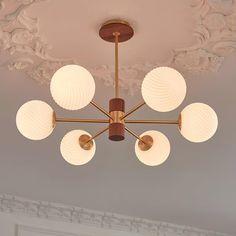 a chandelier hanging from the ceiling in a room