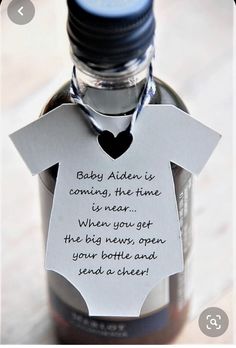 a baby bottle with a note attached to it