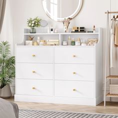 a white dresser and mirror in a room with a rug on the floor next to it