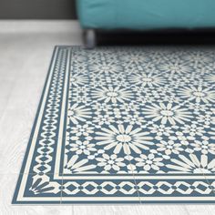 a blue and white rug on the floor