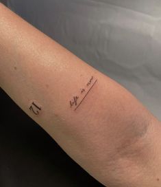 a woman's arm with the word love written in cursive writing on it