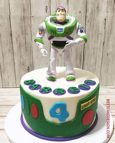 a toy story birthday cake with buzz lightyear figure