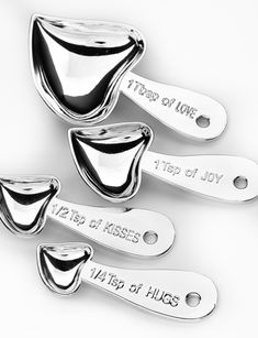 four spoons with names on them sitting next to each other