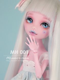 a doll with long white hair and blue eyes is posing for the camera while wearing a dress