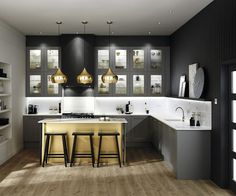 a modern kitchen with black and gold accents