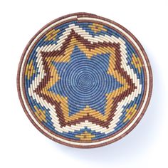 a woven basket is shown in the shape of a star, with blue and yellow colors