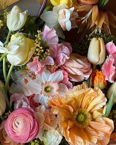 a bunch of flowers that are sitting on a table