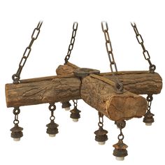 three pieces of wood with chains hanging from them