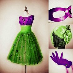 a green tulle skirt and purple mask with question mark on it, two hands in front of the mannequin's head