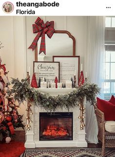 a decorated christmas tree in front of a fireplace