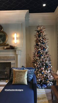 a living room with a christmas tree in the corner