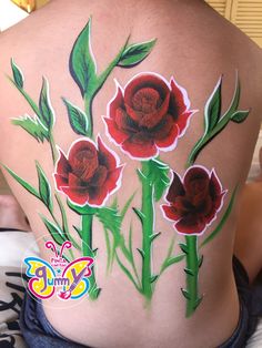 a woman's back with flowers painted on it