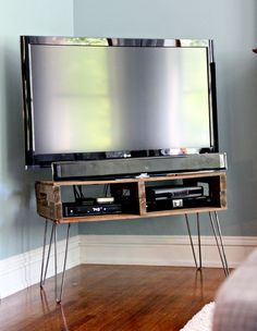 an entertainment center with a television on top of it