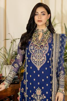 Embroidered Pakistani Salwar Kameez in Premium Chiffon is a luxury choice to wear on the big day. This Pakistani Party Dress in a dark blue shade is emblazoned with embroidery, sequins, and pink floral designs, making it an epitome of beauty and grace. Blue Kameez: The kameez is emblazoned with lavish designs, embroidery, and floral designs. The fabric of this embroidered kameez is chiffon. Intricate yet fine details on this blue kameez make it a perfect choice to wear on the festive occasion. R Organza Styles, Pakistani Designer Clothes, Raw Silk Fabric, Pakistani Salwar Kameez, Embroidered Chiffon, Embroidered Organza, Blue Wedding Dresses, Pakistani Wedding Dresses, Festive Wear