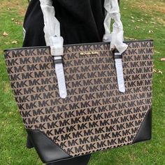 Nwt Michael Kors Lillian Large Top Zip Shoulder Tote Handbag $468 Michael Kors Lillian Large Top Zip Shoulder Tote Handbag $468. Black No Dust Bag Included 100% Authentic Michael Kors! Buy With Confidence! Msrp: $468.00 Style: 35s0giht3j No Dust Bag Included!!! Features: Material: Canvas With Leather Mk Signature Lining Top Zip Closure Interior Zip Pocket, And 2 Slide Pockets Dimensions: 12" L (Bottom ) 16.5 " L (Top) X 11.5 W X 6" D Handle Drop 11" Imported Monogram Canvas Shopping Bag, Brown Signature Coated Canvas Bag For Errands, Large Capacity Monogram Canvas Bag, Bags With Gold-tone Hardware And Monogram Canvas, Brown Signature Coated Canvas Shoulder Bag For Errands, Beige Monogram Canvas Shoulder Bag With Large Capacity, Beige Large Capacity Monogram Canvas Shoulder Bag, Brown Signature Coated Canvas Tote Shoulder Bag, Large Capacity Signature Coated Canvas Bags For Everyday Use