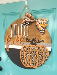 a wooden sign that says hello fall with pumpkins and cheetah on it