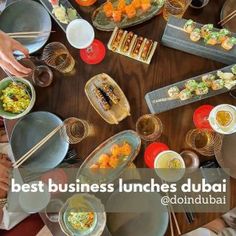 people sitting at a table with plates and bowls of food in front of them that says best business lunches dubai