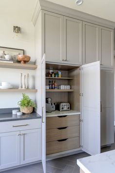 the kitchen is clean and ready to be used as a storage area for food items