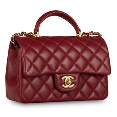 We present 2021’s new Mini Rectangular with Top Handle in the gorgeous combination of Red Lambskin and Antique Gold Hardware. We love her, to say the very least. This perfect little baby is definitely hard to get your hands on. The perfect accessory for basically anything, this mini Chanel is the ideal compliment to any outfit for any occasion. Wear her with a cocktail dress and a pair of heels, or with black trousers with a silk blouse, or even with a pair of jeans and a basic tee - no matter what, this gorgeous bag is a suitable compliment. I mean, you can basically wear a plastic bag and you'll still look bomb with the mini rectangle by your side. A bag you'll wear and love forever, investing in a Classic Flap is always a good idea given that they rarely cease to lose their value. SPL E