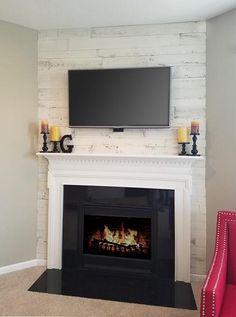 a fireplace with a flat screen tv above it