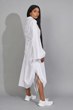 White shirt dress with multi tie-up detail on the sides and adjusting hemline. - Aza Fashions White Tie Fastening Midi Dress For Spring, Spring Midi Dress With Tie Sleeves For Daywear, Elegant Spring Dresses With Drawstring, Elegant Spring Dresses With Tied Details, Spring Dresses With Drawstring Tie For Daywear, Elegant Spring Dress With Side Ties, Fitted Dress With Tie Sleeves For Daywear, Shirt Dress For Women, Shirt Dress Women