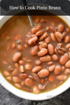 a white bowl filled with beans on top of a table