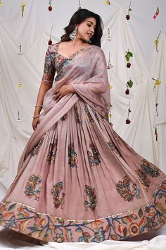 Sand rose pink attached cancan lehenga with all over peacock, floral hand painted kalamkari pattern. Paired with a blouse with floral kalamkari pattern, elevated with sequins and dupatta. - Aza Fashions Luxury Fitted Lehenga With Kalamkari Print, Luxury Designer Kalamkari Print Lehenga, Designer Silk Lehenga With Kalamkari Print, Designer Wear Silk Lehenga With Kalamkari Print, Pink Anarkali Set With Kalamkari Print For Festivals, Pink Unstitched Kalamkari Traditional Wear, Silk Kalamkari Print Lehenga For Wedding, Unstitched Pink Kalamkari Traditional Wear, Pink Kalamkari Anarkali Set For Festivals