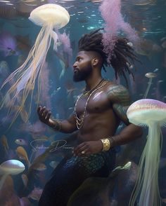 a man with dreadlocks standing in front of jellyfish