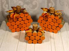 two orange pumpkins made out of wine corks