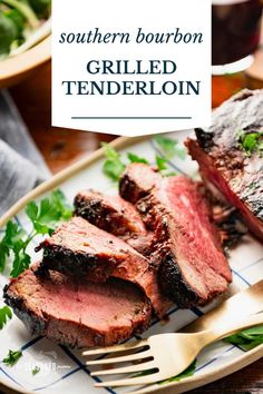 grilled tenderloin on a plate with a fork and garnished parsley