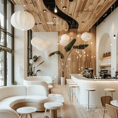 the interior of a restaurant with wooden ceiling and white furniture